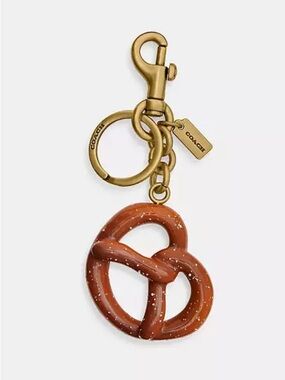 HOT!!!!  Coach Gold-Tone Pretzel Purse Charm in Brown.  NWT and Dusty